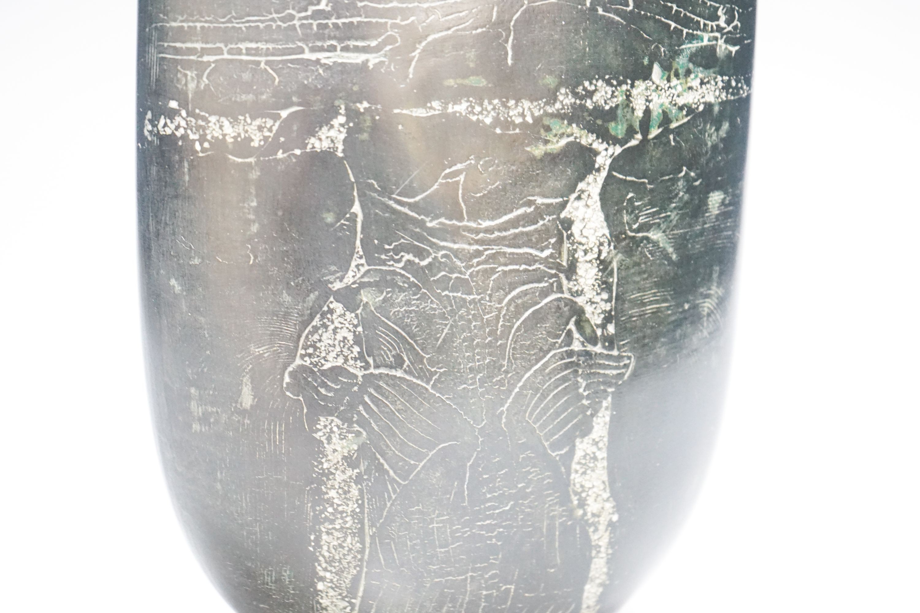 Peter Hayes (b.1946), a black raku glaze Bow form bottle, 29cm